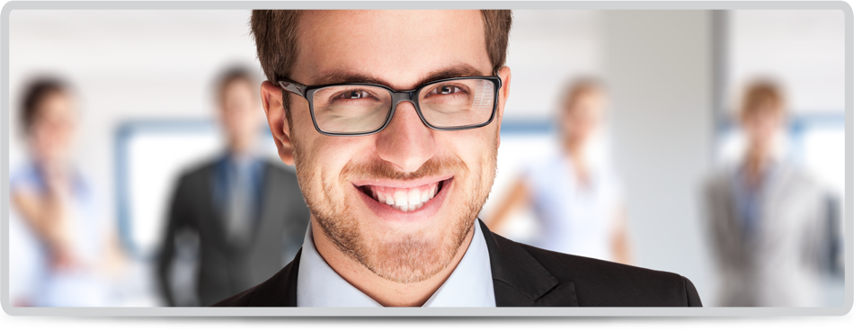 Portrait of a handsome businessman in front of his team 